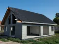 Dom w stanie surowym otwartym, z dachem pokrytym czarną dachówką. Ściany z bloczków betonowych, bez okien i drzwi.